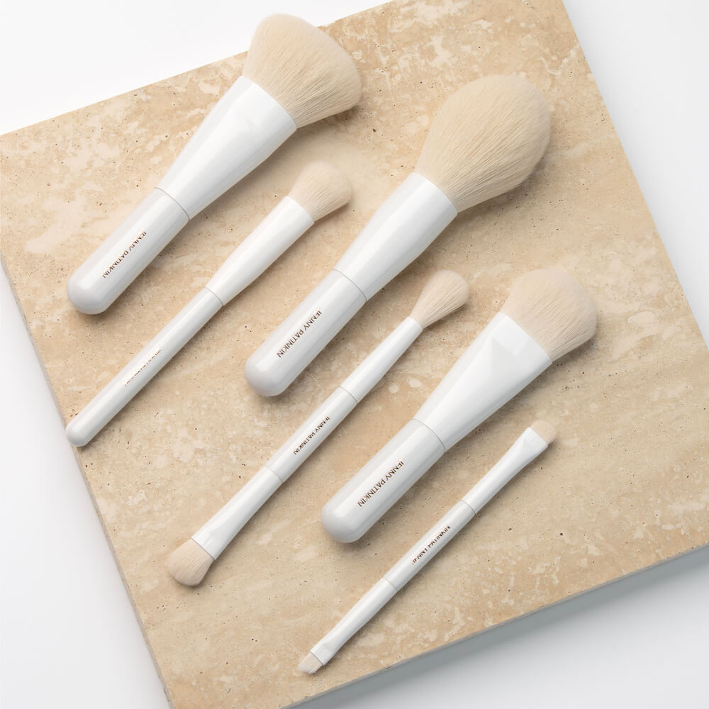 Atelier Blanc Travel Makeup Brush Set with white handles and cream bristles