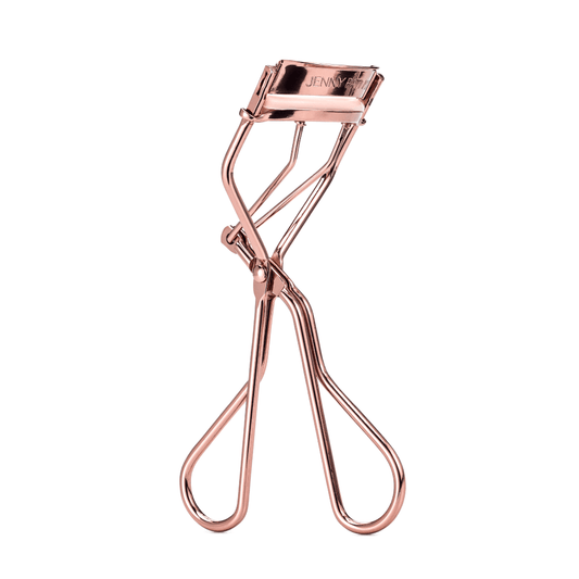 Jenny Patinkin Big Reveal Eyelash Curler in rose gold with light pink bumper pad designed for hooded and deep-set eyes