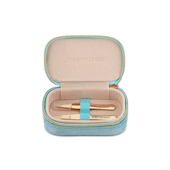 An open light blue zippered case with a beige interior, containing two gold cosmetic tools and a turquoise elastic band. The brand name 'JENNY PATNIKON' is embossed on the inner lid and printed on the tools.