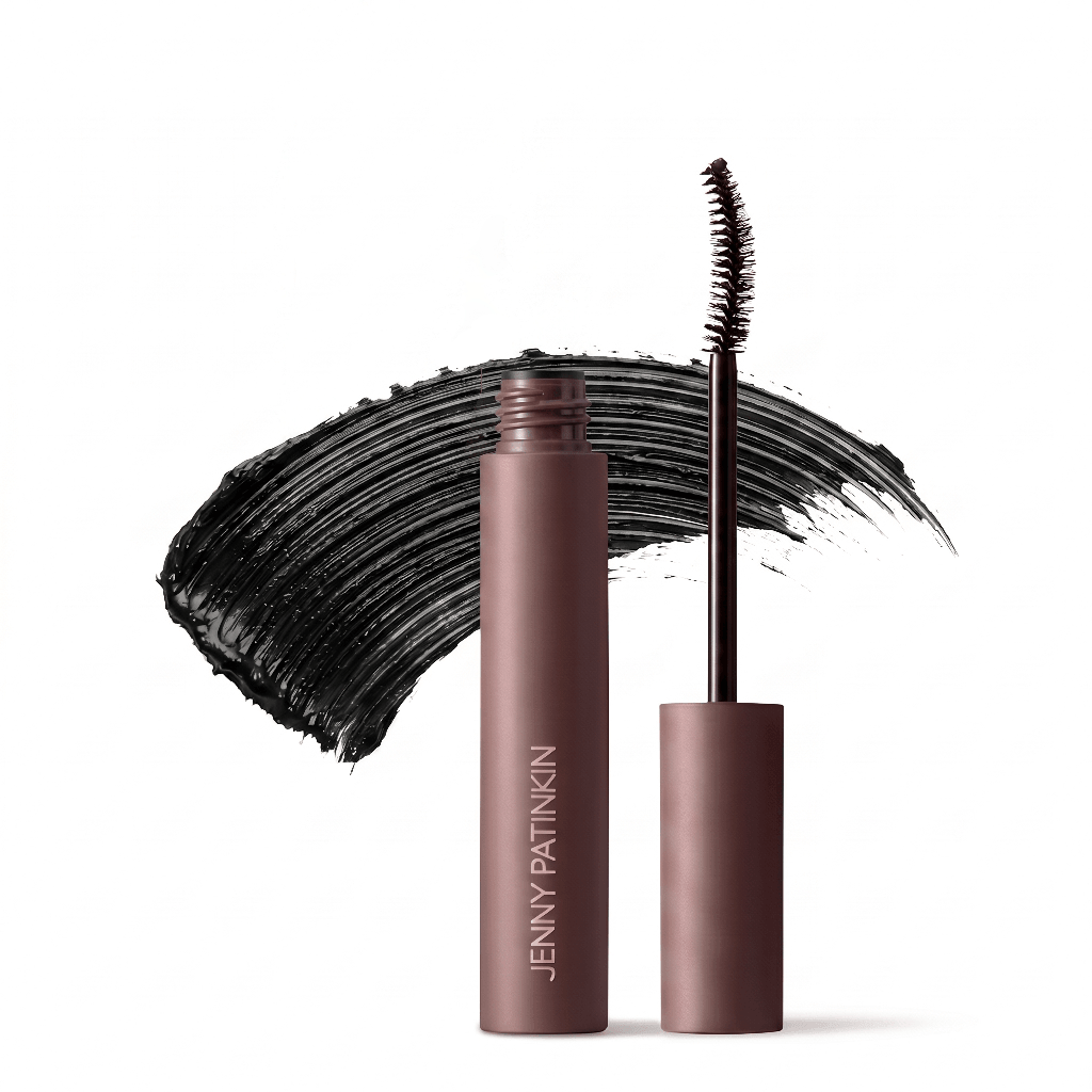 Jenny Patinkin Big Reveal Mascara in black with curved applicator wand alongside a bold black mascara swatch background